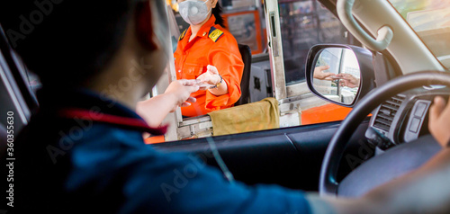 Photography Selective focus to driver pay for the expressway