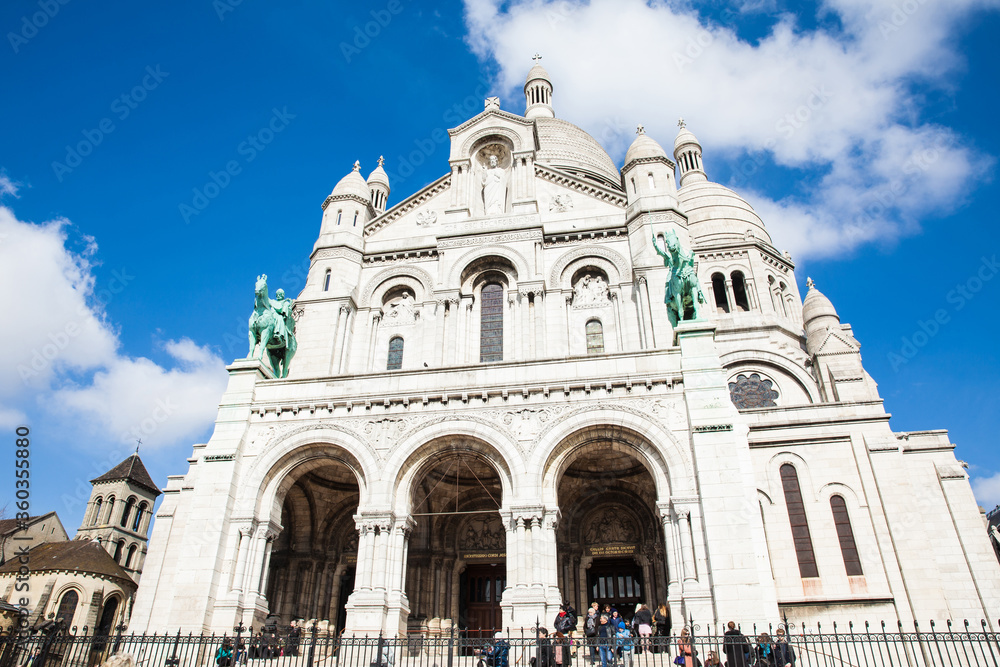 Tourists visiting the Sacre Coeur Basilica at the Montmartre hill in Paris France