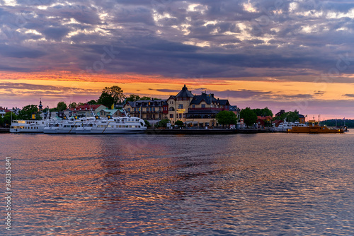 Vaxholm with boats at the quay and hotel a nice summer evening