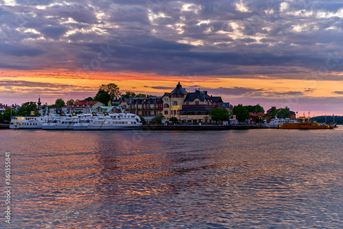 Vaxholm with boats at the quay and hotel a nice summer evening photo