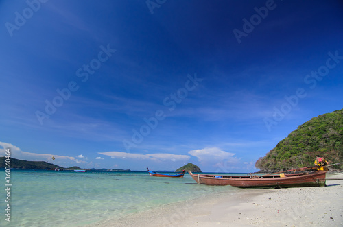 long-tail boat on the beach © Iammaikung