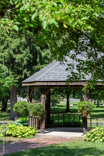 Landscaped gazebo pavilion in a city park garden area