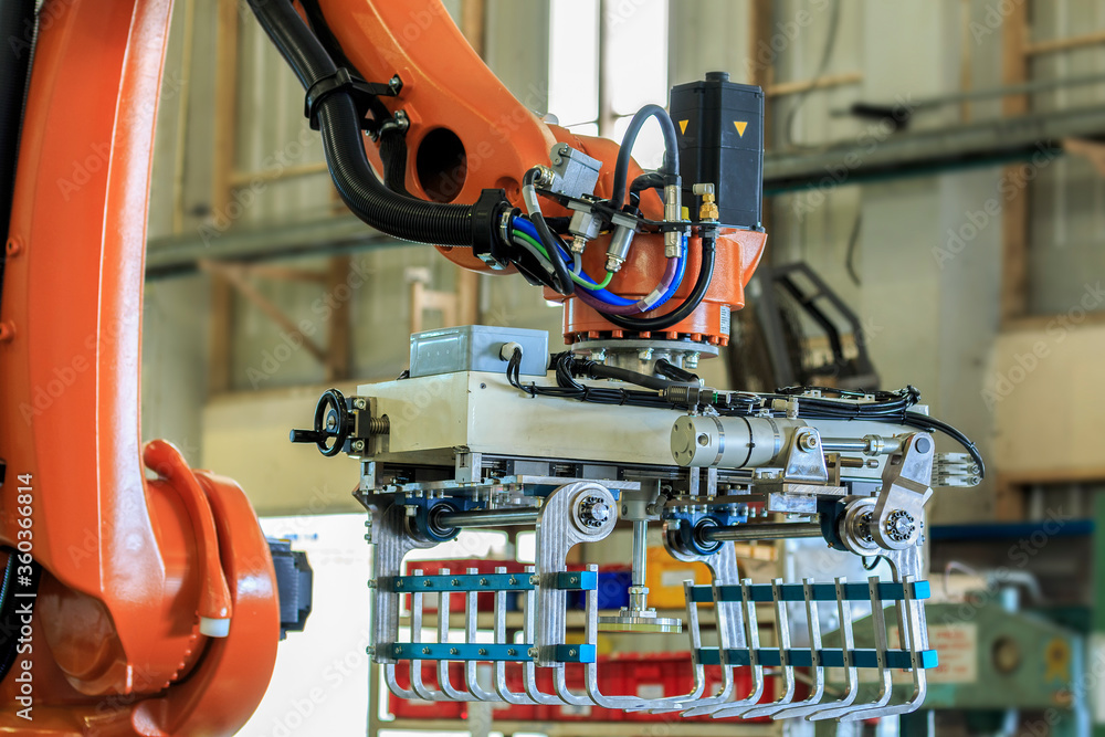 View of gripper unit on industrial robot in automation line View of gripper unit on industrial robot in automation line
