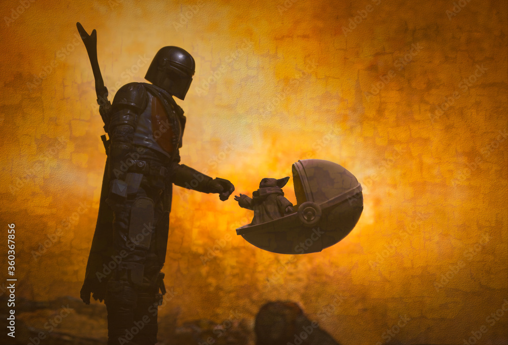 Naklejka premium NEW YORK, USA - JUNE 20 2020: Star Wars scene from Disney Plus The Mandalorian with The Child aka Baby Yoda - Hasbro action figures