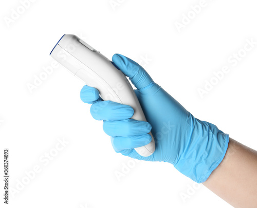 Doctor in latex gloves holding non-contact infrared thermometer on white background, closeup