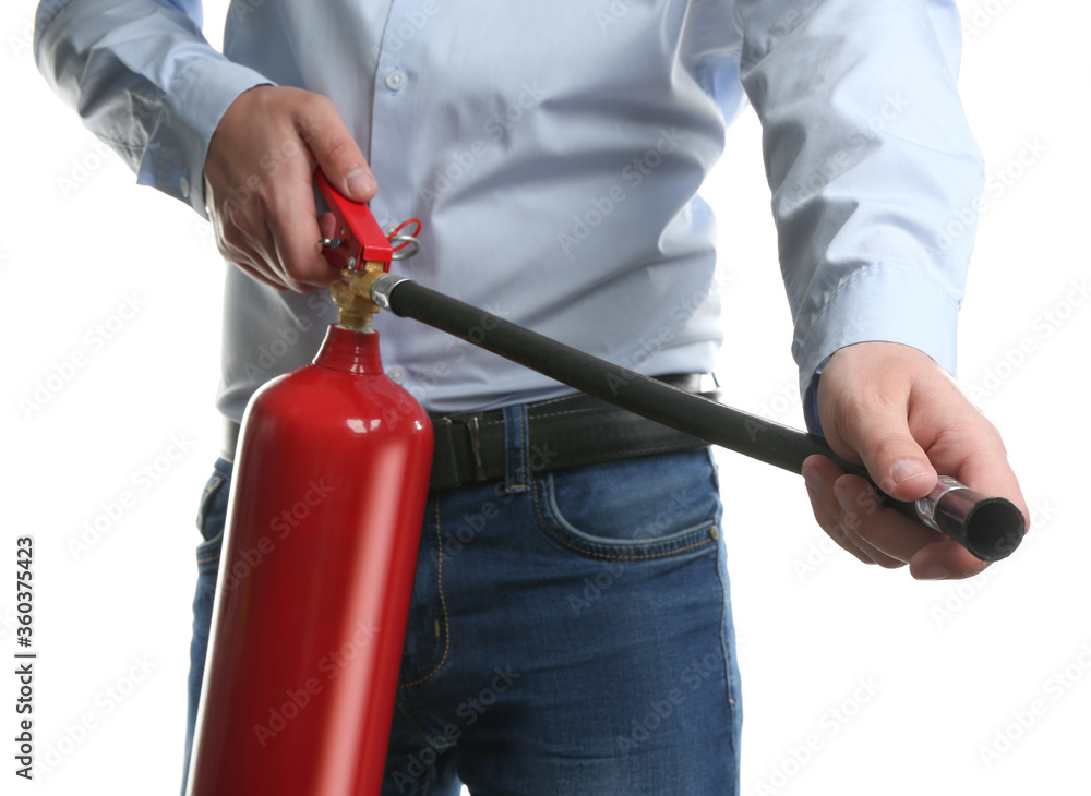 Naklejka premium Man using fire extinguisher on white background, closeup
