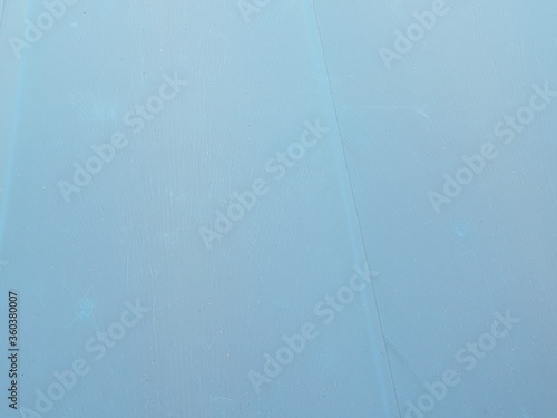 Obraz na płótnie Blue canvas roof. Roofing material and finishing of buildings. w salonie