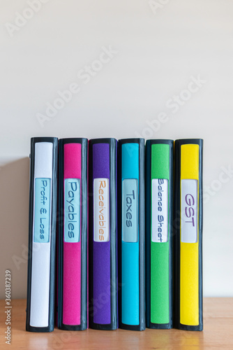 Set of color coded files and binders used by bookkeeper and accountant