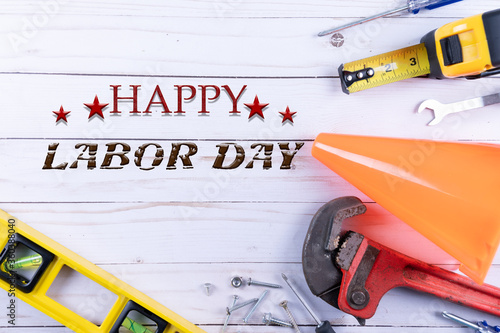 Happy Labor day. Construction tools on wooden background. Labor day concept. Copy space. photo