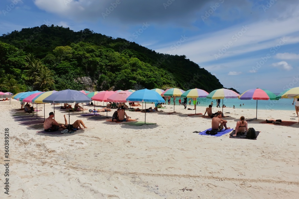 beach with umbrellas and chairs