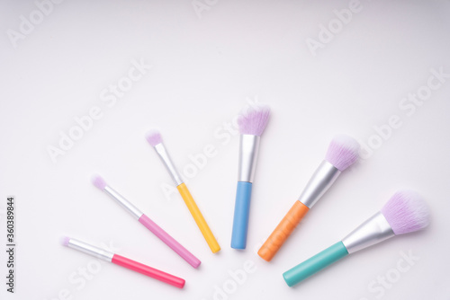 Top view - Pastel rainbow colourful brush isolate over white background.