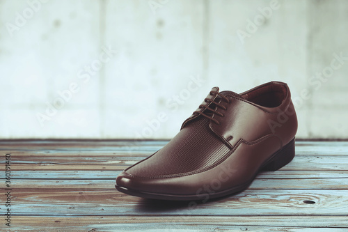 Men s formal leather Shoes isolated on wooden table