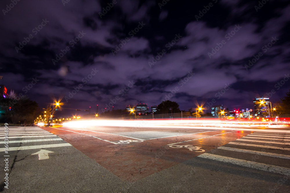 illuminated shot of intersection. Showing busy city life with cloud. South Korea.