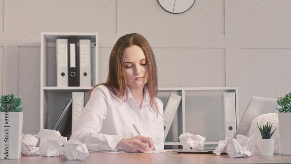 Office worker lifestyle. Remote job. Business woman tired of boring paperwork writing notes. Office worker lifestyle. Remote job. Business woman tired of boring paperwork writing notes.
