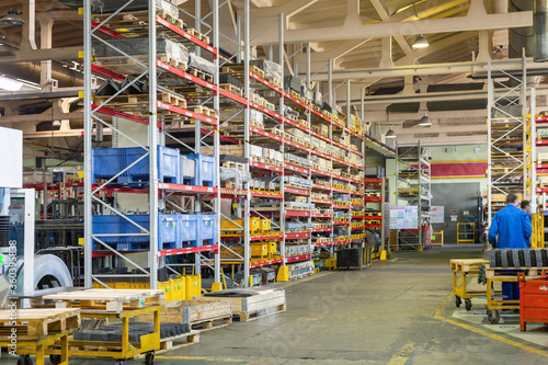 Factory warehouse steel reinforcement. High stacked shelving.