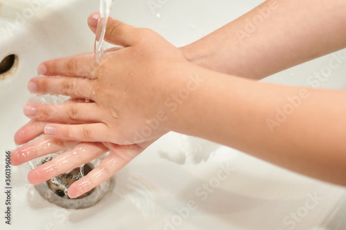washing hands with soap under the tap. There is no pandemic.