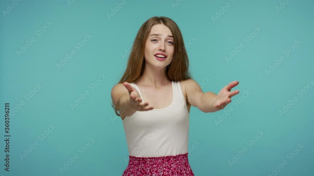 Amazing open-hearted beautiful girl giving from heart, gesturing Take it for free, looking kindly at camera, sharing love care, generosity concept. indoor studio shot isolated on blue background Amazing open-hearted beautiful girl giving from heart, gesturing Take it for free, looking kindly at camera, sharing love care, generosity concept. indoor studio shot isolated on blue background