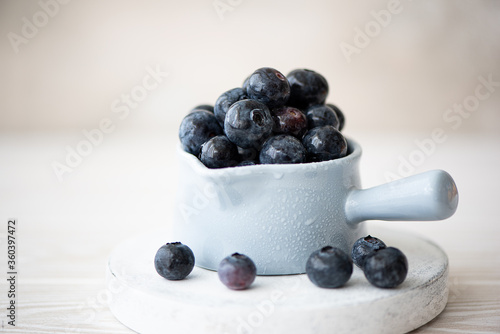 fresh large blueberries in bowl, close up