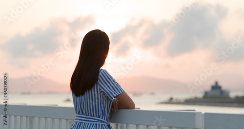 Photography Woman look at the city in the evening