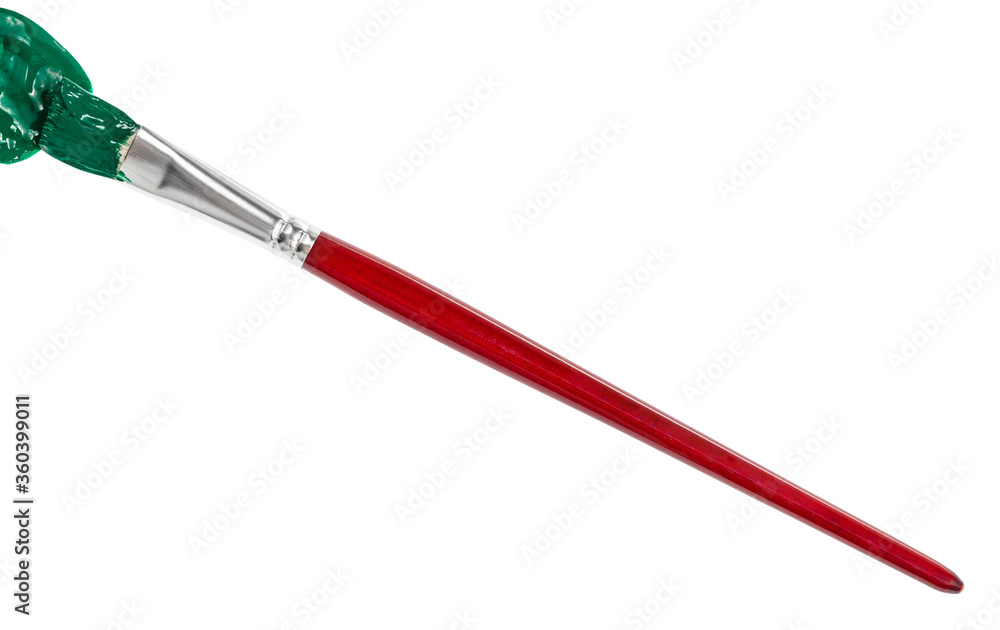 flat paint brush with green colored tip in blot and brown handle isolated on white background flat paint brush with green colored tip in blot and brown handle isolated on white background