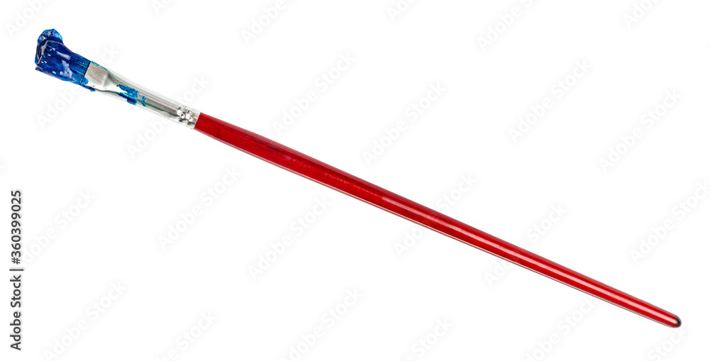 flat paint brush with blue colored tip in blot and brown handle isolated on white background flat paint brush with blue colored tip in blot and brown handle isolated on white background