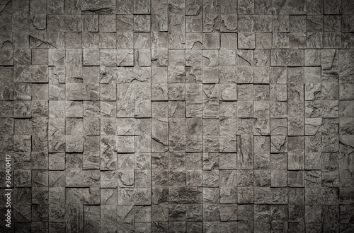 concrete wall of small textured squares
