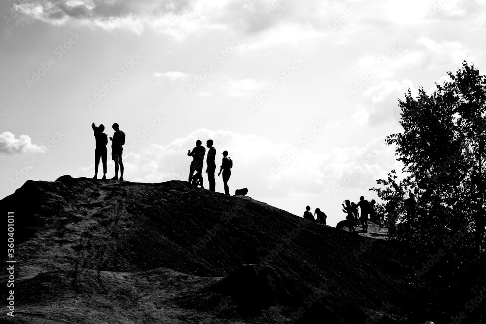 Tourists on the slope of the Romantsevsky mountains, Tula region, Russia.