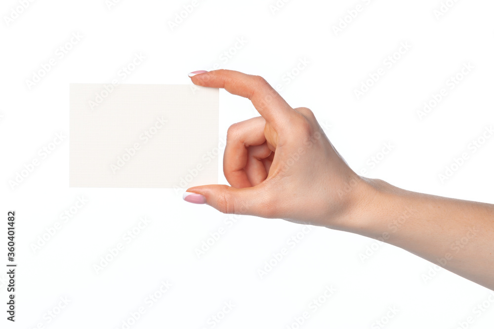 Woman's hand with blank white business card isolated on white Woman's hand with blank white business card isolated on white
