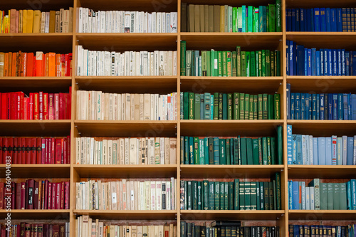 View of shelves with old books in library