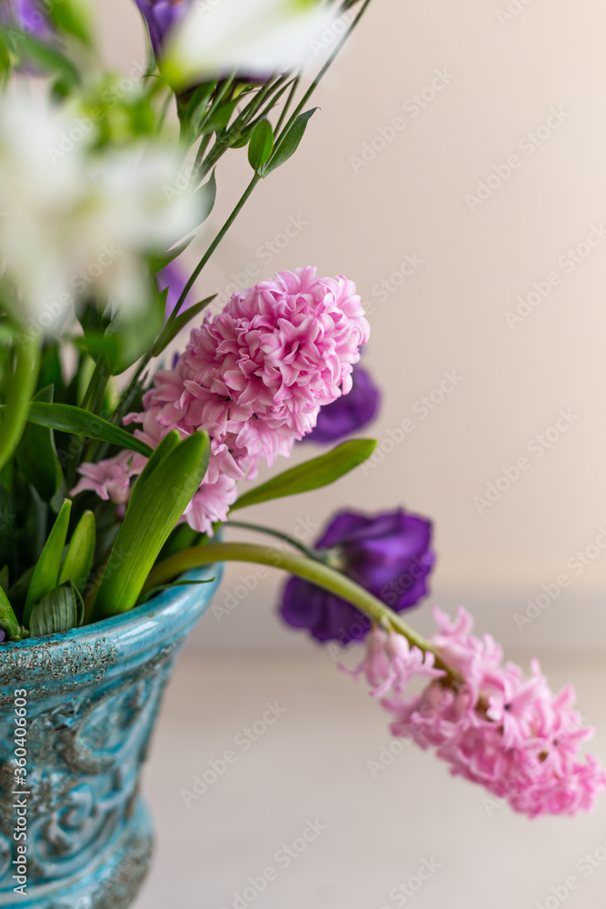 Bouquet of pink hyacinthus in a turquoise rustic vase Bouquet of pink hyacinthus in a turquoise rustic vase