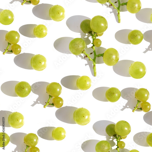 seamless pattern of green grapes with hard shadow close-up, top view, flat lay. Food background.