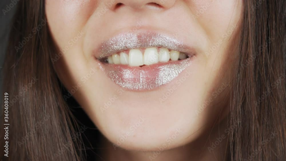 Fashion model woman lips in bright sparkles, beautiful sexy lips. Extreme close-up of full lips. Fashion model woman lips in bright sparkles, beautiful sexy lips. Extreme close-up of full lips.