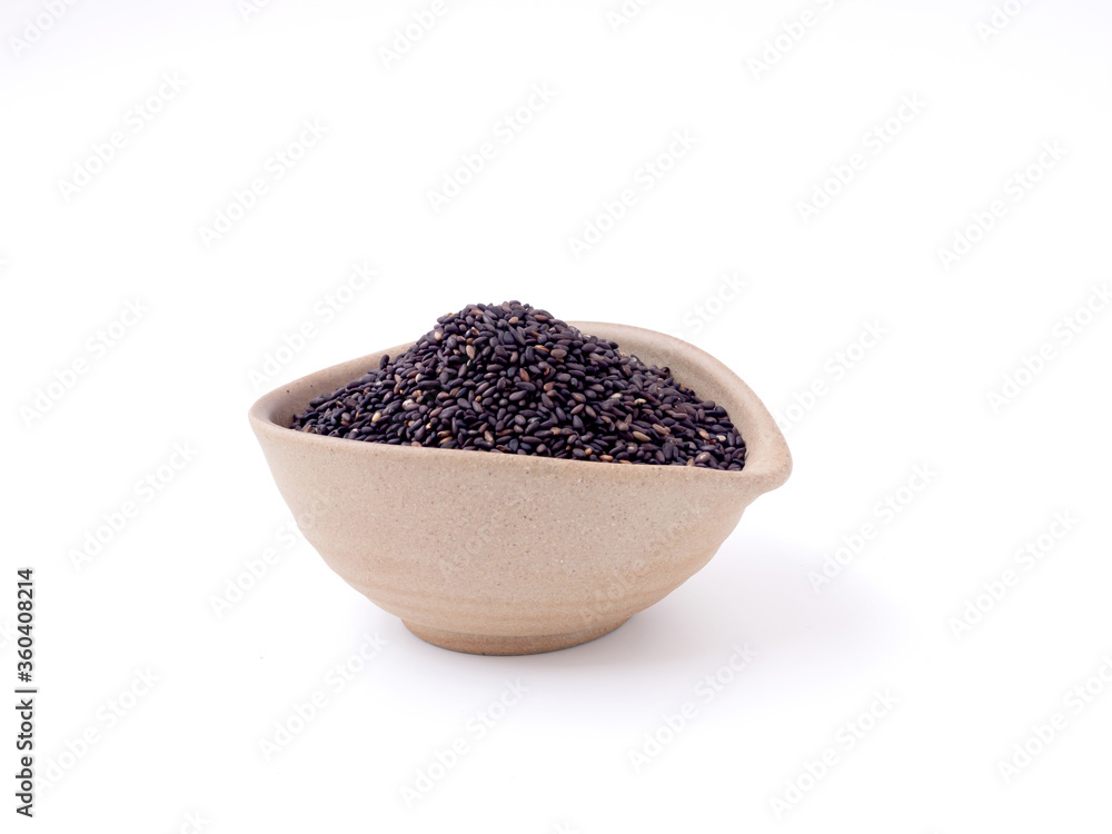 Organic black sesame seeds in brow old clay bowl isolated on a white background, for healthier bones and decreases the risk of cancer... Organic black sesame seeds in brow old clay bowl isolated on a white background, for healthier bones and decreases the risk of cancer...
