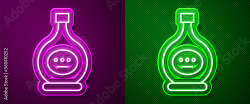 Glowing neon line Bottle of cognac or brandy icon isolated on purple and green background. Vector Illustration.