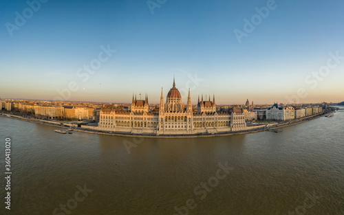 Aerial drone shot of Hungarian Parliament facade during Budapest sunset © Davidzfr