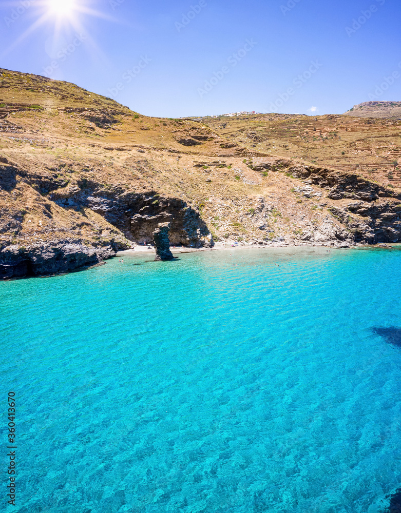 The emerald and turquoise sea of Andros island, Cyclades, Greece, at the beach 