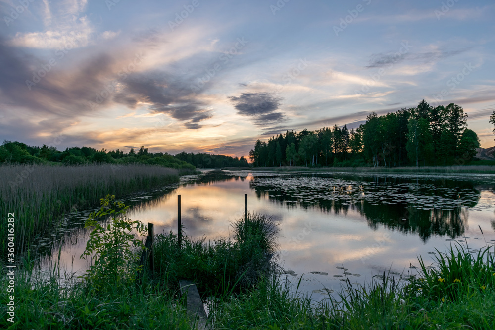 picture with beautiful colorful sunset over the lake, a wonderful place of strength and energy, peace, harmony and quiet