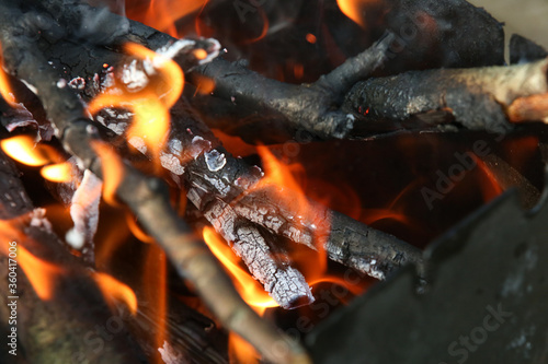  Fire with coals on a picnic . Preparing coals for cooking meat. Outdoor activities.