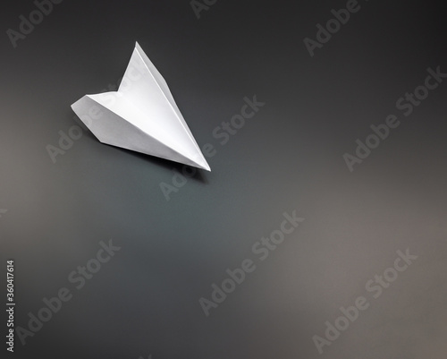 White Paper airplane flying downward
