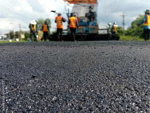 Blur image, asphalt paving With heavy machinery © suwichan