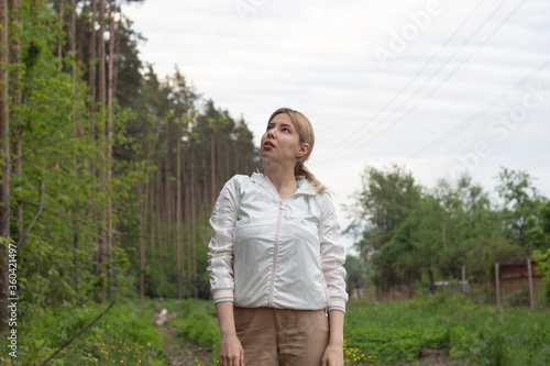 Young girl in the woods girl walks in the forest. Happy, outdoor.