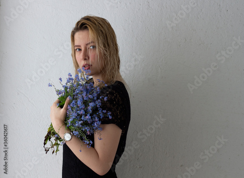 girl with white hair with the flower in hands