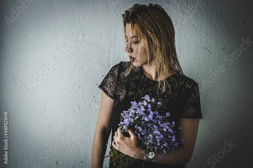 girl with white hair with the flower in hands