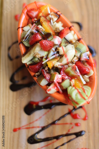 Fresh Fruit Salad in Red Bowl on Dark Background