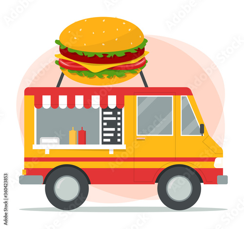 Fast food truck. Street food mobile cafe. Image of a big hamburger on the van. Colorful transport. Delicious snack in vehicle.