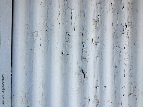 White rustic abstract design background chipped paint flaking corrogated metal sheet photo