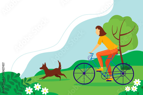 Woman riding a Bicycle with the dog in the Park. Summer landscape with trees and flowers.