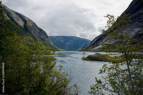 Fototapeta Naklejka Na Ścianę i Meble -  Scenic view of Nigardsbrevatnet lake surrounded by mountains - Jostedalsbreen national park, Norway
