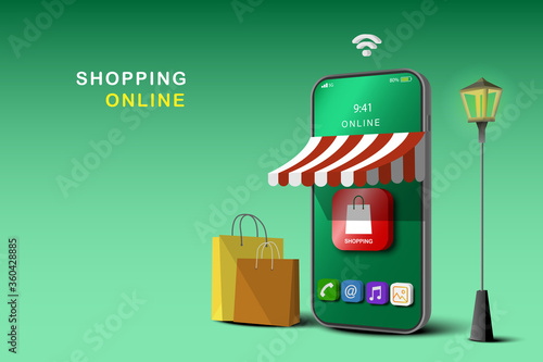 Shopping Online on Website or Mobile Application Concept Marketing and Digital marketing, Green Background. Store and shop on smartphone.