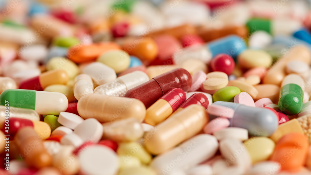 Close-up of many colorful medicines drugs and pills Close-up of many colorful medicines drugs and pills